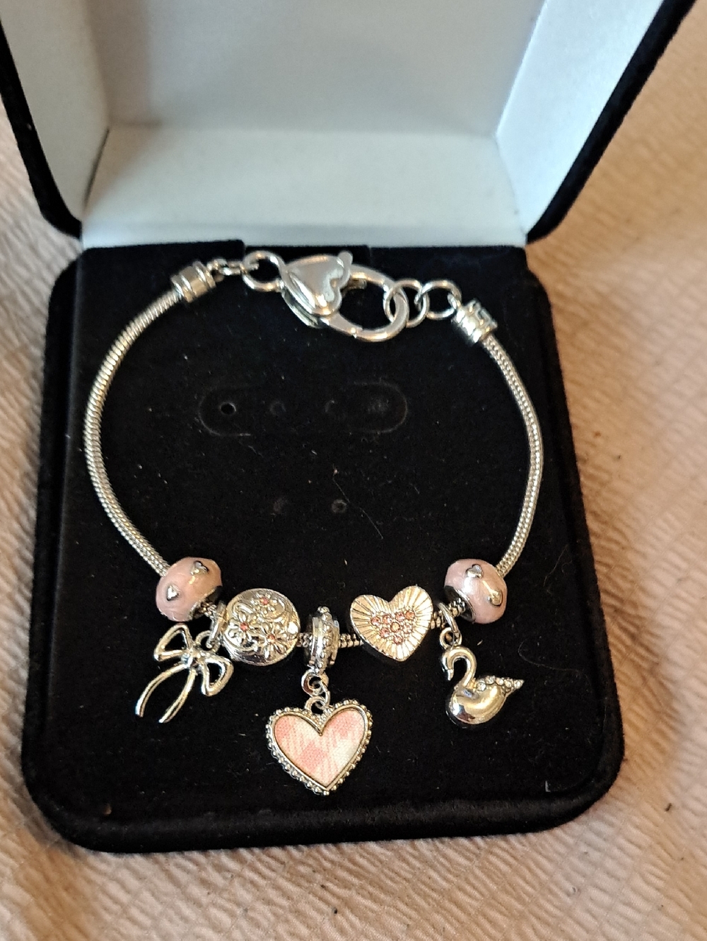 Silver Charm Bracelet with Pink Accents and Heart & Swan Charms